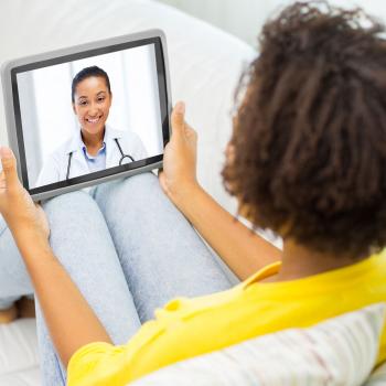 woman having medical consultation online with female doctor